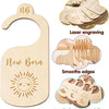 A set of seven wooden baby closet dividers with laser engraved and patterned edges for newborn to toddler clothing.