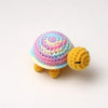 Handmade crocheted turtle plush with a multicolored shell and yellow body