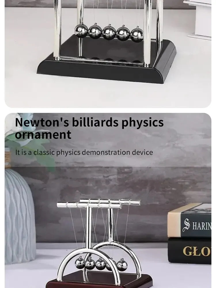 A silver Newton's physics ornament featuring three polished metal balls suspended between two rods on a dark base.