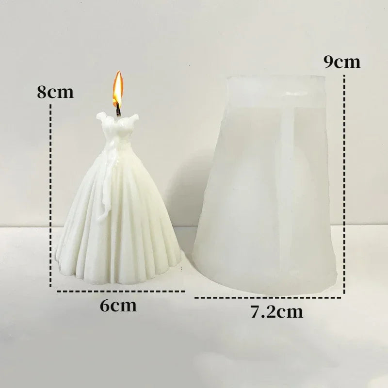 White silicone mold shaped like a wedding dress used for making candles or chocolate.