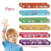 A child holds a set of 10 colorful unicorn themed stickers for a birthday party.