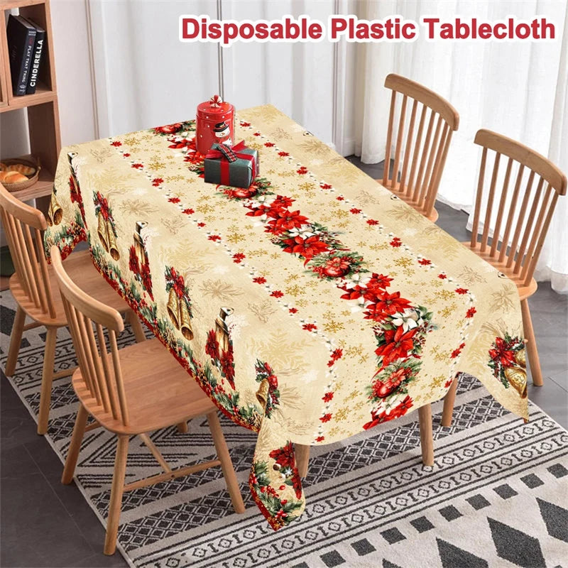 A beige tablecloth featuring a vintage Christmas design with red poinsettia and bell patterns on a wooden table.