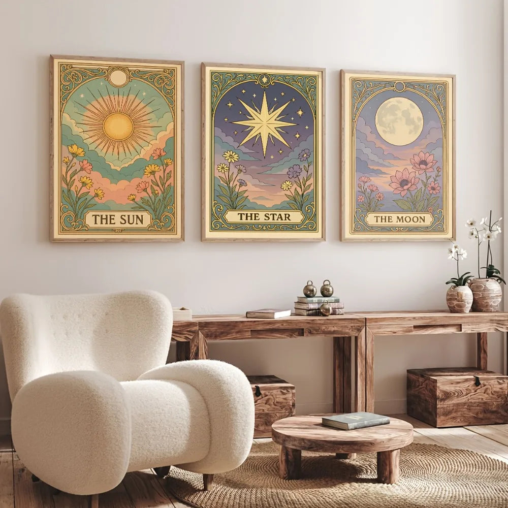 A set of three framed celestial prints featuring the sun, star, and moon on a muted background.