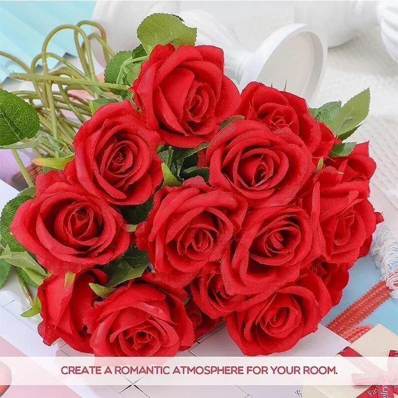 A bouquet of vibrant red artificial silk roses arranged for table decor.