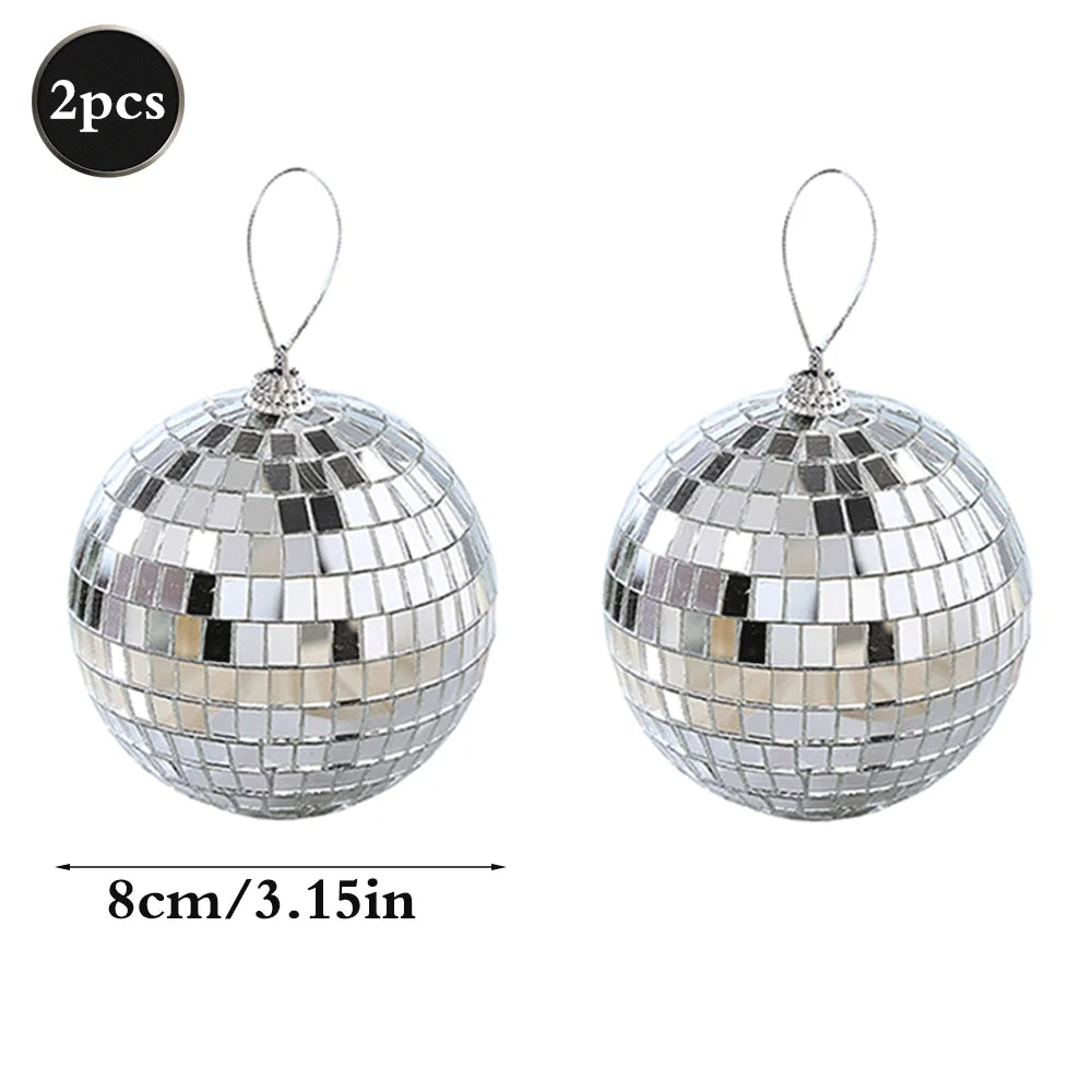 Two silver disco mirror balls with hanging loops for parties and decor
