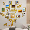 A wall collage featuring various framed photos and gold leaf tree elements with the text Family Where Life Begins Love Never 