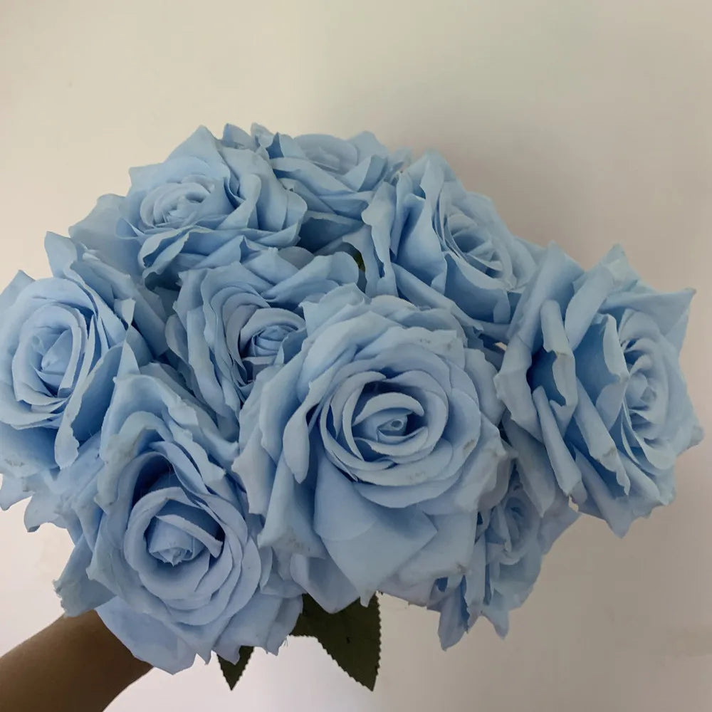 A bouquet of light blue silk roses used for home and wedding decor.