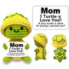 A handcrafted crochet turtle doll in yellow and green yarn, designed as a gift for mom.