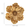 A large, golden, flower-shaped resin wall art piece with layered petals.