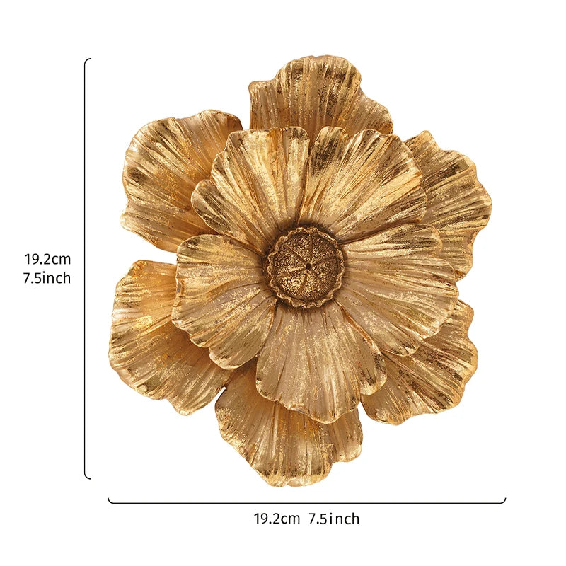 A large, golden, flower-shaped resin wall art piece with layered petals.