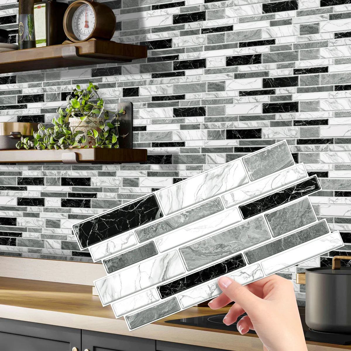 A hand holds a sheet of crystal film marble wall decal against a black and white marble tile background.