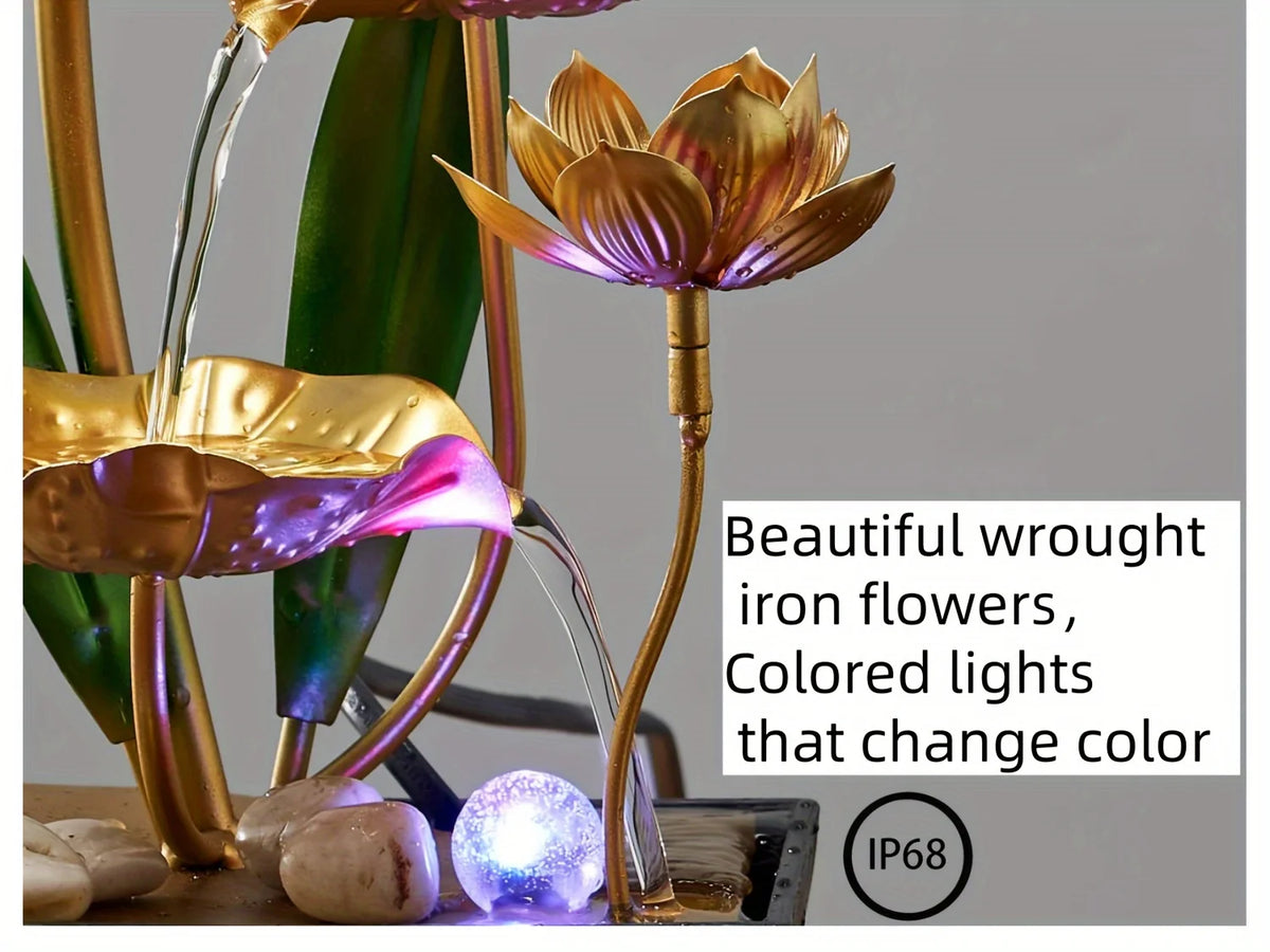A golden iron flower fountain with colored lights that change color, featuring water flow and smooth stones.