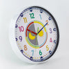 A round, colorful silent wall clock with a white face and black rim displaying numbers and hour markings.