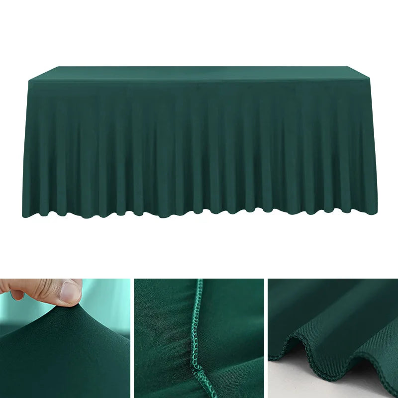 A dark green stretch rectangle tablecloth draped over a table, showing close-ups of the fabric texture.