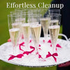 A set of disposable champagne glasses with a gold finish are displayed on a white plate.