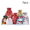 Seven reusable drawstring gift bags featuring various Christmas and winter themes like snowflakes and snowmen
