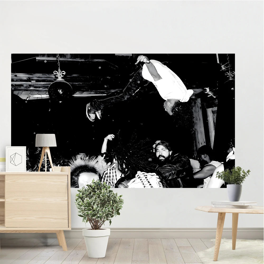 A large canvas wall tapestry featuring a dark, dramatic scene with figures and flags.