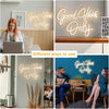 A large decorative LED neon sign spelling out Good Vibes Only displayed in various indoor settings.