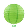 A round, lime green paper lantern with vertical folds.