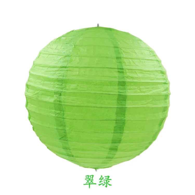 A round, lime green paper lantern with vertical folds.