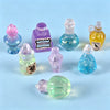 A collection of miniature resin magic potion bottles in various colors including pink, purple, blue, and yellow.