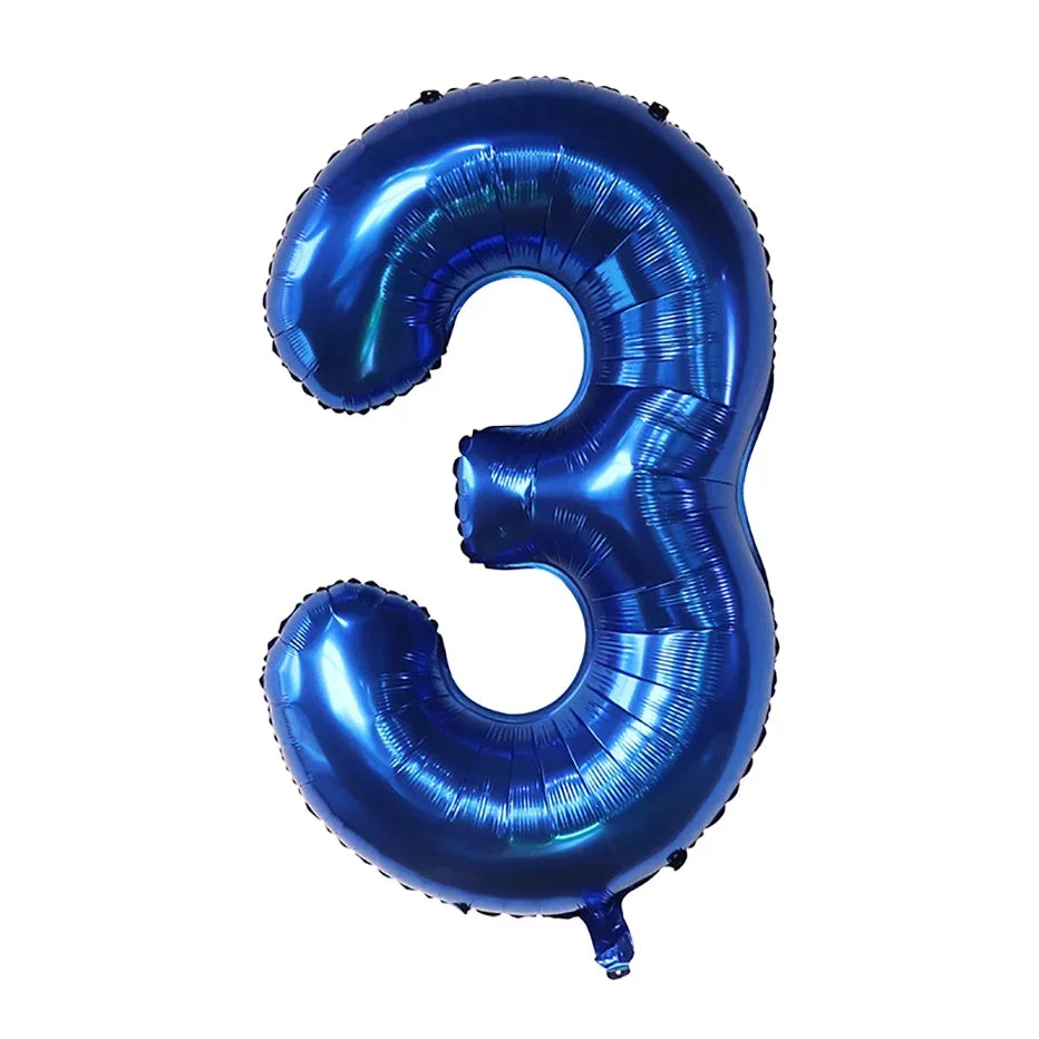 A large, dark blue foil number balloon shaped like the number three for party decor.