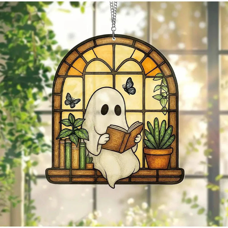 A Halloween ghost figure with a book is displayed in a stained glass window frame decorated with plants and butterflies.
