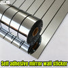 Roll of self adhesive mirror wall sticker showing reflective silver strips on a white background