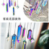 A set of seven crystal prism sun catchers hanging, featuring various iridescent colors and shapes.