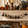 Vintage Halloween wooden hanging garland featuring retro pumpkin, ghost, and cat beads on a white shelf.