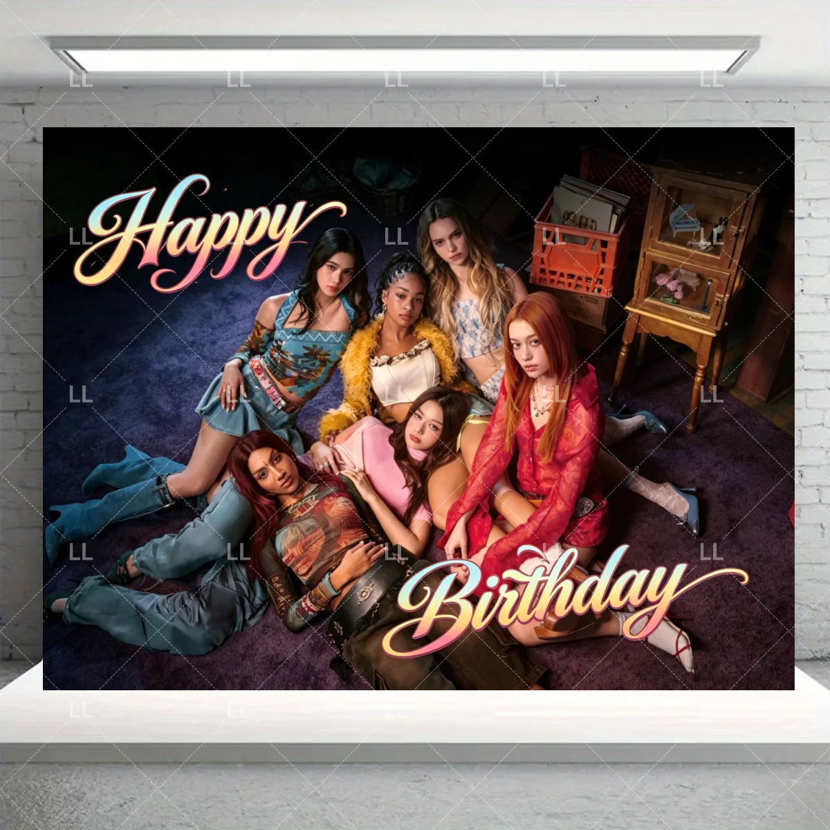 A group of five young women posing for a birthday photo in a dark, moody setting with a glowing light above them.