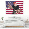 A tapestry featuring a hand making the devil sign against an American flag background.