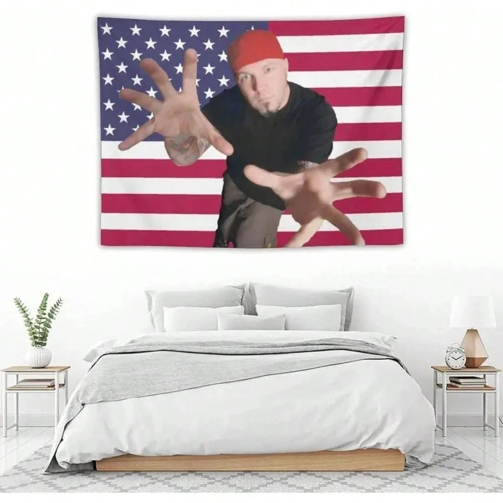 A tapestry featuring a hand making the devil sign against an American flag background.