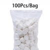 A bag containing 100 pieces of white compressed camping towels.