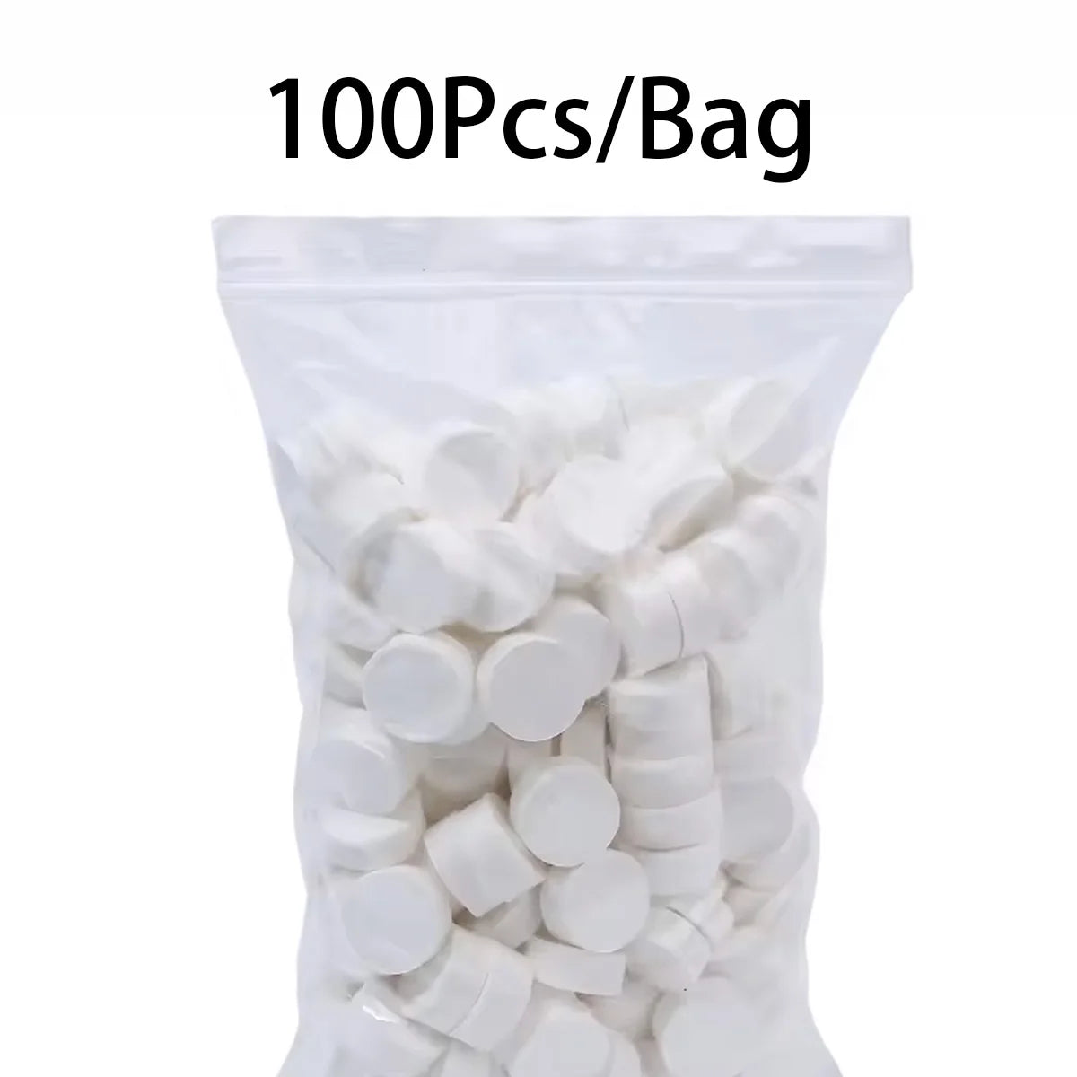 A bag containing 100 pieces of white compressed camping towels.