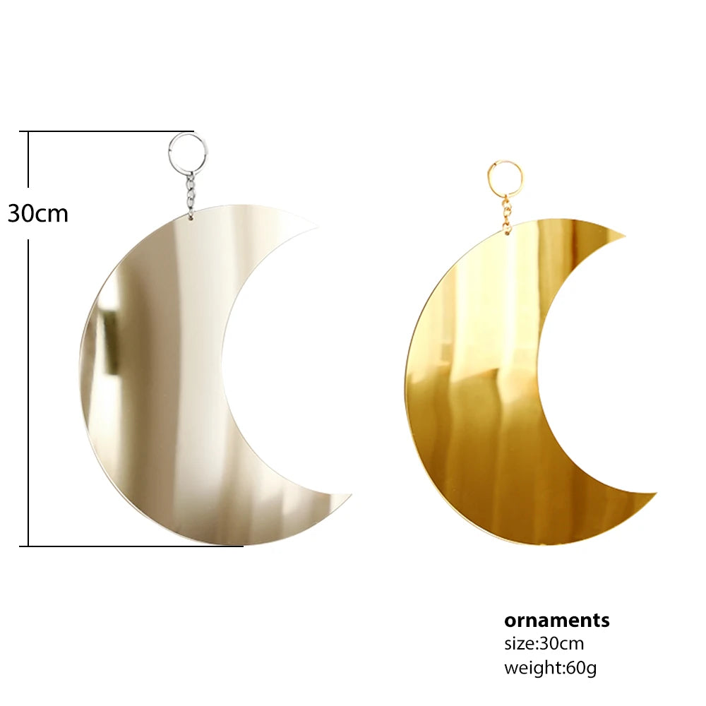 Gold moon acrylic wall mirror with a hanging loop, shown in profile view.