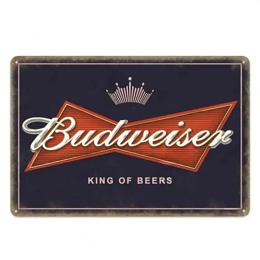 A vintage metal sign featuring the Budweiser logo and crown, used for bar or pub decor.