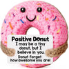 Pink crochet donut ornament with a smiling face and text encouraging positivity