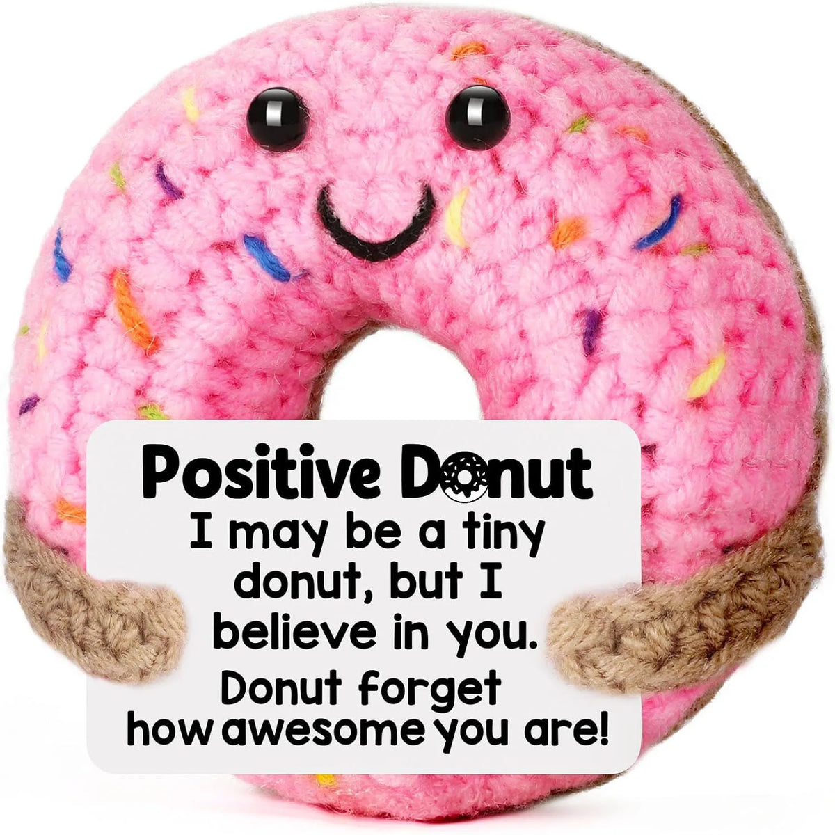 Pink crochet donut ornament with a smiling face and text encouraging positivity