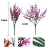 A vertical arrangement of artificial magenta and purple flowers on a stem, shown with scale reference.