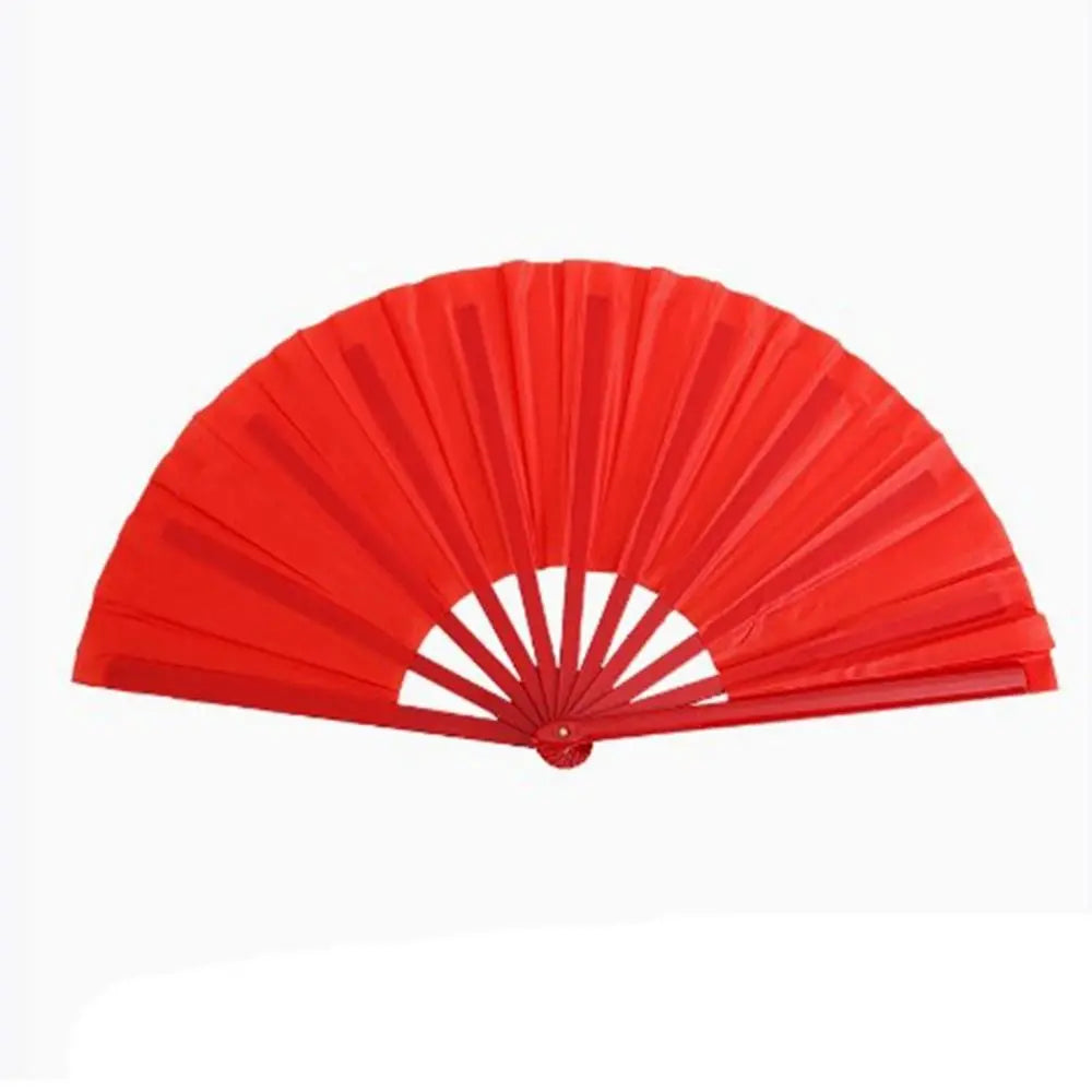 Red plastic fan with durable ribs used for Tai Chi performance.
