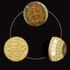 Gold-plated commemorative coin featuring a Maya prophecy calendar design.