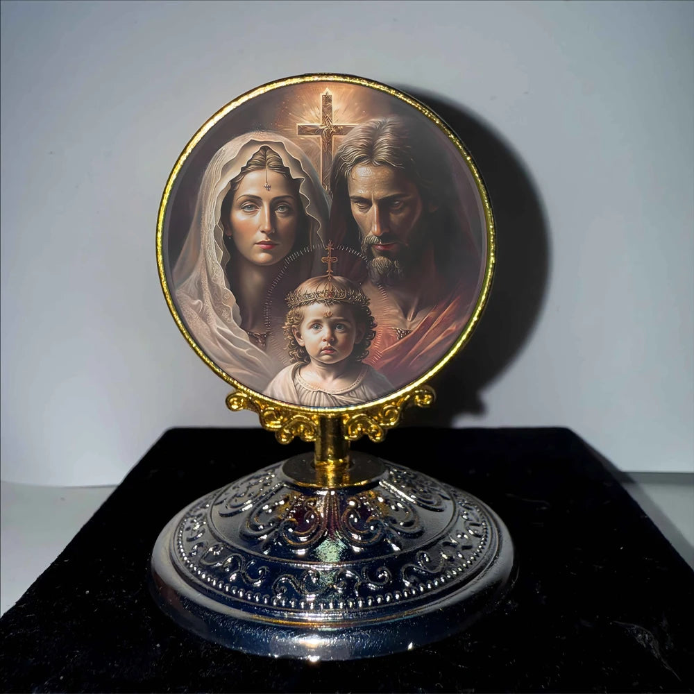 A round gold-rimmed painting featuring the Virgin Mary and Christ, used as a tabletop ornament.