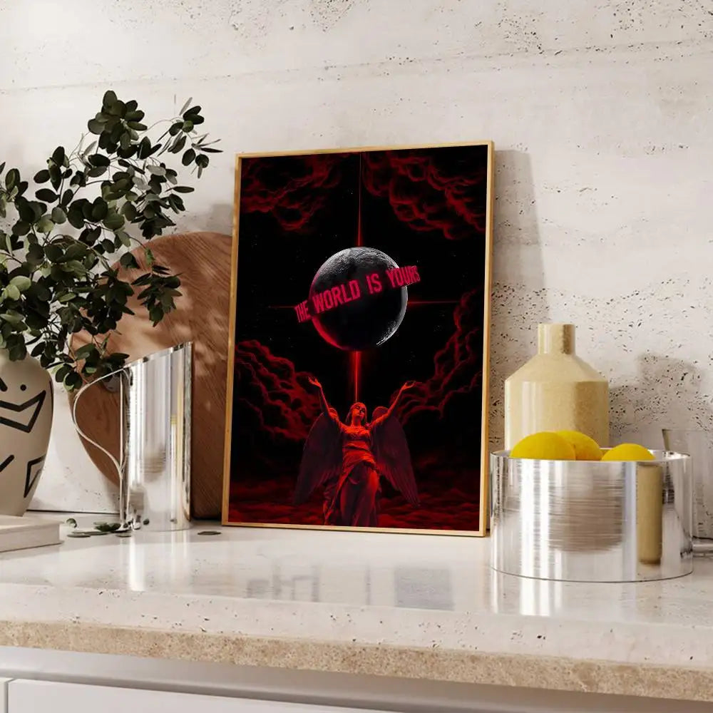 A framed poster featuring a dark red background with a glowing sphere and the text BE THE WORLD IS YOURS.