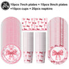Pink bow disposable party tableware set including plates, cups, and napkins