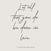 A black script rendering of 1 Corinthians 16:14 on a light gray background.