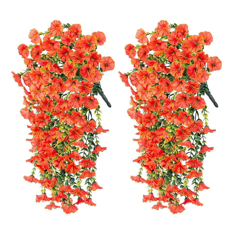 Artificial hanging morning glory flowers in vibrant orange and red with green eucalyptus leaves