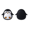 A pair of black silicone plant beads shaped like an owl with white facial features and orange feet.