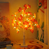 Warm glow maple tree tabletop decoration with lights featuring autumn-colored leaves.