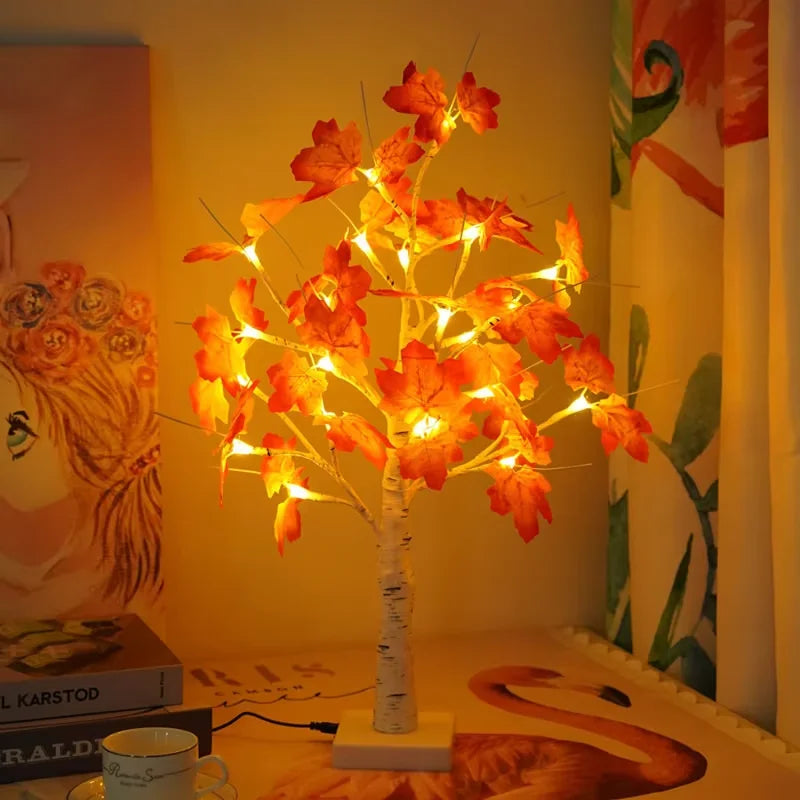 Warm glow maple tree tabletop decoration with lights featuring autumn-colored leaves.